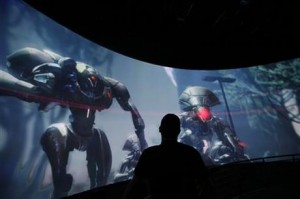Alex Beckers watches a presentation on the video game “Destiny” at the Activision Blizzard Booth during the Electronic Entertainment Expo in Los Angeles (AP photo)