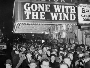 A crowd gathers outside the Astor Theater on Broadway during New York City’s Gone with the Wind premiere in December 1939 (AP photo)