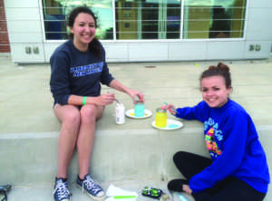 Katie O’Connor (left) and Liz Rourk (Right) members of TWLOHA decorating mason jars for the Lanterns of Love event (Photo by Francesca Fontanez) 