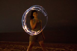 A fire spinner, Anna, performed for Erica and the others on the Strand (Photo by Erica Naugle/Charger Bulletin photo)