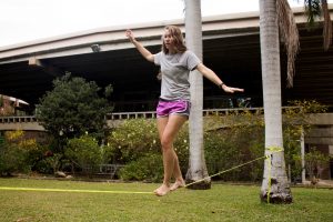 Erica testing her balancing skills on a 1” slack line (Photo by Erica Naugle/Charger Bulletin photo)