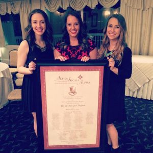 The Alpha Sigma Alpha Leadership Consultants pose with the Theta Omega charter From left to right, Kelly Taveras, Abby Somers and Aubrey Winn  (Photo provided by Abby Somers via Facebook)