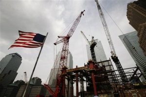 Construction cranes work above the Freedom Tower at the World Trade Center, Tuesday, Sept. 8, 2009, in New York.