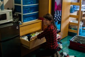 One freshman unpacks her clothes as she moves in to Botwinik Hall