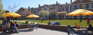 Students enjoying a break in the Maxcy Quad outside the Bartel’s Hall Campus Center on UNH’s main campus. (UNH Photo)