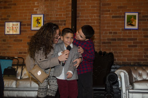 Adrian Laureano singing alongside his mother, Jasmine Gonzalez, and his brother, Josue Alvarez  (Photo by Samantha Mathewson/Charger Bulletin photo) 