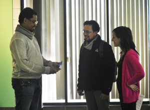 Felandus Thames (left) talks with vistors of the gallery. (Photo provided by Laura Marsh)