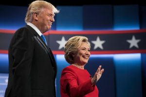 Democratic presidential nominee Hillary Clinton, right, stands with Republican presidential nominee Donald Trump at the start of the presidential debate at Hofstra University in Hempstead, N.Y., (AP Photo/Matt Rourke)